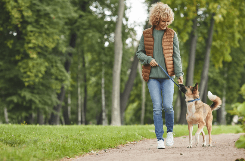 running dog while owner holding leash on the dog