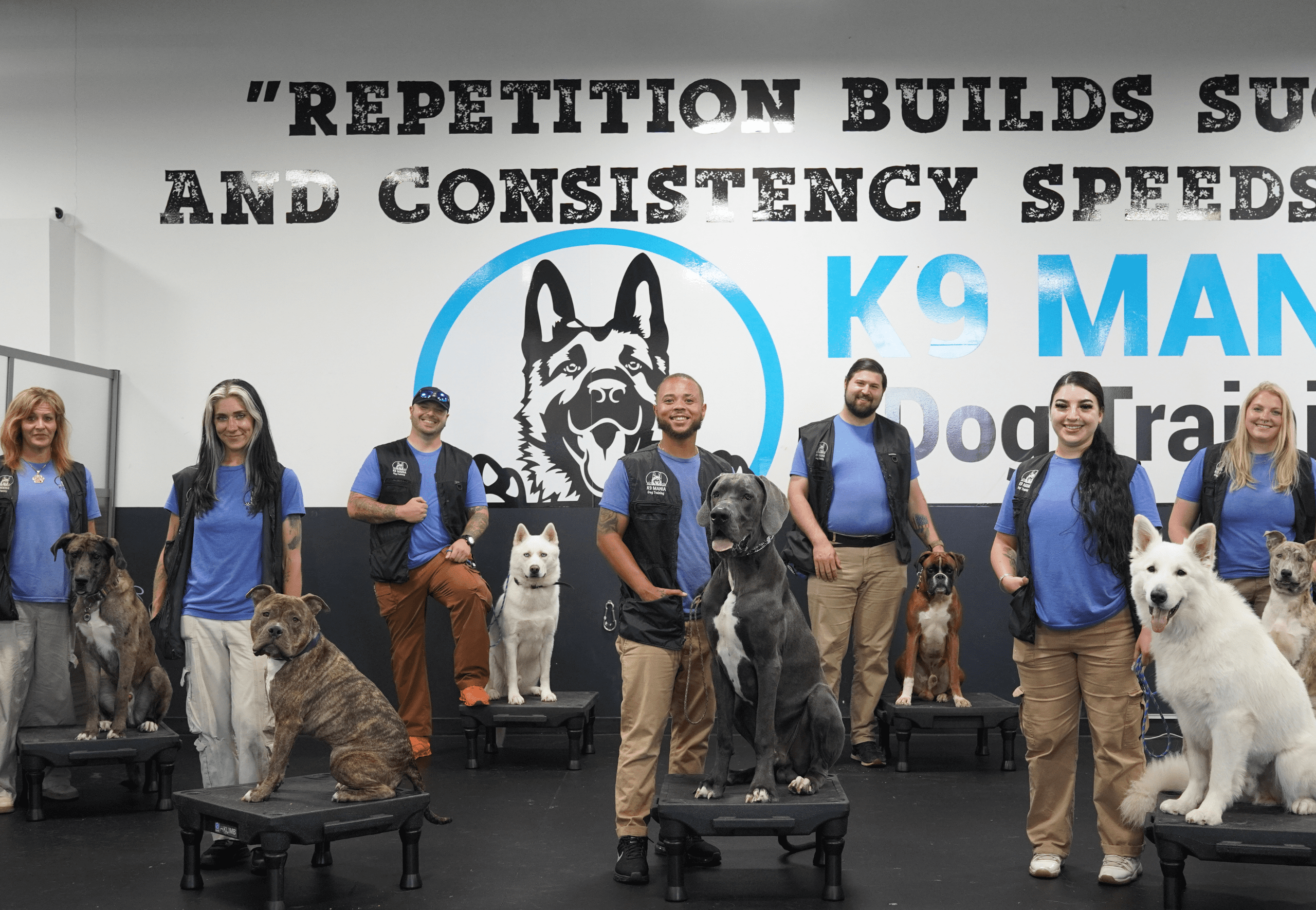 Our Commitment to Safety 5 The K9 Mania Dog Training team smiling and showcasing their passion for training dogs with expertise, dedication, and care, ready to help dogs and owners succeed in their training journey